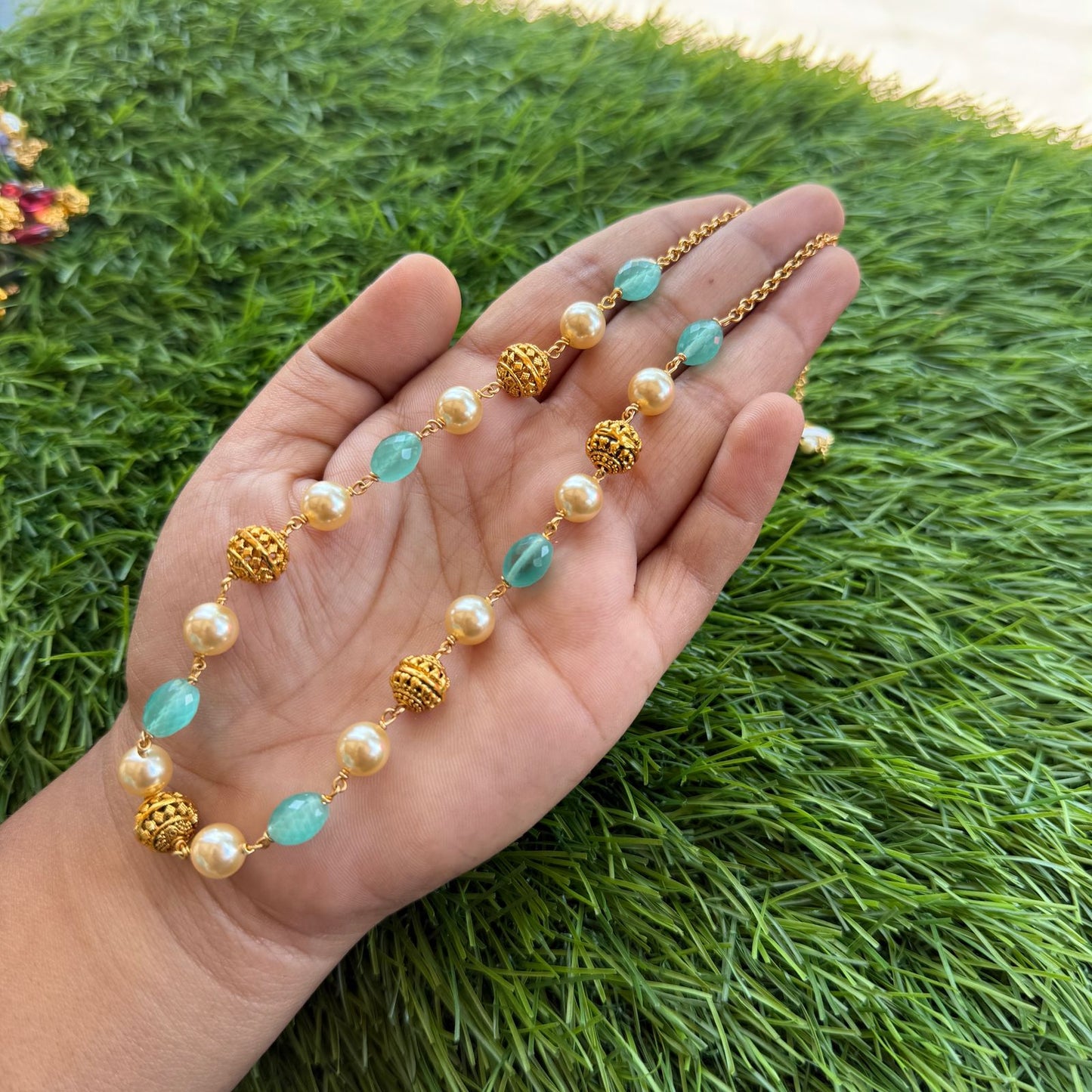 Gold and off white pearl chain